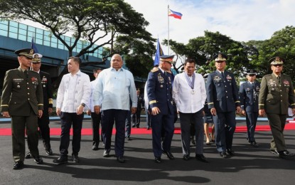 <p>President Rodrigo Roa Duterte is accompanied by Sec. Bong Go of the Office of the Special Assistant to the President, Executive Secretary Salvador Medialdea, Philippine National Police Director General Oscar Albayalde, Philippine Air Force (PAF) Commander Galileo Kintanar, Jr., and Armed Forces of the Philippines Chief of Staff General Carlito Galvez, Jr. during the 71st founding anniversary of PAF at the Multi-Purpose Gymnasium in Colonel Jesus Villamor Air Base (CJVAB), Pasay City on July 3, 2018. <em>(Robinson Niñal Jr./Presidential Photo)</em></p>